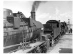 Ein Lokzug aus drei 57.10 nimmt Wasser auf einem unbekannten Bahnhofs Rußlands. (1943) <i>Foto: RVM (Bandelow)</i>