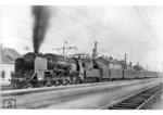 12 007 (ex BBÖ 214 07) vor D 37 im Bahnhof Attnang-Puchheim. (03.06.1942) <i>Foto: RVM Berlin</i>