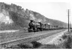 Die ehemalige CSD-Lok 534 022, eingereiht als DRG 58 2212, mit einem Güterzug vor der Kulisse der Bastei bei Rathen. (06.1942) <i>Foto: Werner Hubert</i>