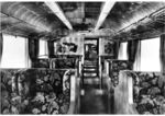 Blick in das 1. Klasse-Abteil des elT 1900 (späterer ET 11 01). Die Wände sind mit Birnbaumholz, die Decken mit poliertem Ahorn getäfelt. Die Intarsien im Hintergrund zeigen deutsche Städtebilder. (1935) <i>Foto: RVM</i>