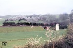 023 018 + 052 838 befördern den als "Fischzug" bekannten Sg 51347 bei Reichenberg in Unterfranken. (30.04.1975) <i>Foto: Peter Schiffer</i>