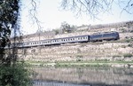 Blick über den Neckar bei Besigheim auf die vor E 2554 (Stuttgart - Kaiserslautern) vorbeiziehende 110 234. (28.04.1975) <i>Foto: Peter Schiffer</i>