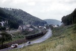 78 319 vor einem Personenzug Kaiserslautern - Saarbrücken bei Scheidt (zwischen St.Ingbert und Saarbrücken). Im Vordergrund verläuft die Bundesstraße 40. (17.08.1958) <i>Foto: Brian Bittner</i>