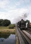 012 063-4 überquert vor dem Saisonschnellzug D 1734 (Emden-Außenhafen - Köln) die Emsbrücke bei Meppen. (01.09.1974) <i>Foto: Peter Schiffer</i>