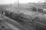 44 126 + 44 611 mit Versuchswindleitblechen im Bahnhof Dresden-Altstadt. Im Hintergrund rangiert eine 23.10 einen Doppelstockwagenzug. (16.07.1964) <i>Foto: A.E.Durrant</i>