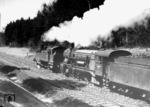 Eine württembergische T 5 (Baureihe 75) leistet einer württ. C (18 128) Vorspann auf der Gäubahn durch den Roher Wald bei Stuttgart. (1940) <i>Foto: RVM (Ulmer)</i>