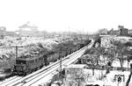 244 128 des Bw Engelsdorf (Bz Leipzig) mit Üg 73649 von Leipzig Bayer Bf nach Leipzig-Connewitz in Leipzig-Marienbrunn. Im Hintergrund ist der noch vollständige Gasometer an der Rudi-Lehmann-Straße zu sehen, der 2003 in ein Ausstellungshaus ('Panometer') umgewandelt wurde. (24.01.1984) <i>Foto: Thomas Fischer</i>