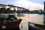 Die 1920 fertiggestellte Brücke über den Nord-Ostsee-Kanal bei Hochdonn ist auch heute noch eines der beliebtesten Fotomotive der Marschbahn. Im Sommer 1968 fährt eine 01.10 mit dem D 134 in der Abenddämmerung über die Hochbrücke. (09.1968) <i>Foto: Jürgen Hagemann</i>