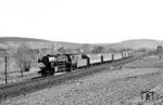 23 059 befördert den P 2879 (Oberburken - Würzburg) bei Sachsenflur. (25.03.1967) <i>Foto: Reinhard Gumbert</i>