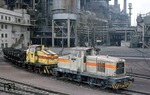 Die werkseigenen Dieselloks D 16 + D X (eine Henschel "D" und "C") in den Hüttenwerken Dillingen. (12.03.1976) <i>Foto: Peter Schiffer</i>