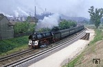 Vor der Kulisse des "VEB Bergbau- und Hüttenkombinat Maxhütte" fährt 01 1518 mit E 802 nach Leipzig in Oberwellenborn vorbei.  (08.06.1980) <i>Foto: Wolfgang Bügel</i>