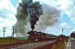 Heftige Winde machten 03 0085 bei Rambin auf Rügen vor dem 11 Wagenzug des D 270 spürbar zu schaffen - und Murphy machte im entscheidenden Augenblick noch das Licht aus. (30.04.1979) <i>Foto: Wolfgang Bügel</i>