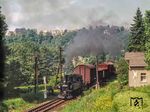 99 1582 mit einem Güterzug nach Niederschmiedeberg auf dem Dreischienengleis bei Wolkenstein. (01.08.1982) <i>Foto: Joachim Schmidt</i>