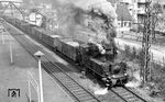 Ausfahrt der Werklok 2 der Portland-Zementwerke Werk Leimen aus Heidelberg-Kirchheim. Die ehemalige württ. T 3 (ex 89 398) war offenkundig noch auf den Gleisen der DB zugelassen. (06.04.1963) <i>Foto: Helmut Röth</i>
